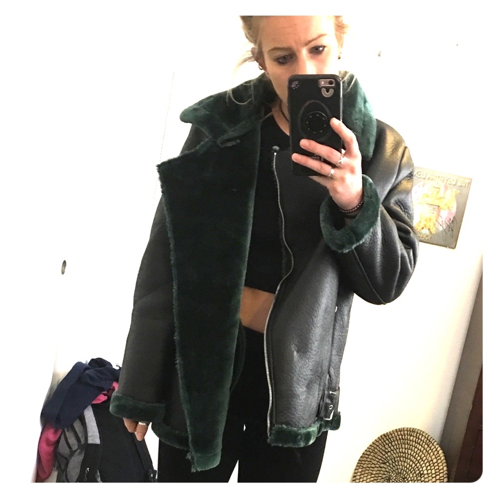 Black faux leather jacket with green faux fur